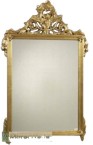 Intricately ornate carvings on the classical mirror, finished with a quality gold leaf