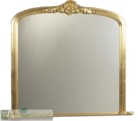 Decorative tradition overmantle with intricately carved head piece, in a quality gold leaf finish. Plain mirror