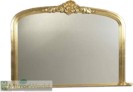 Decorative tradition overmantle with intricately carved head piece, in a quality gold leaf finish. Plain mirror