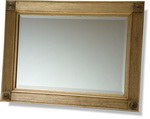 Period frame in gold with ribbed sides and decorative circular corner embellishments, Bevelled mirror