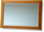 Wide flat antiqued pine frame, bevelled mirror. Available in many sizes.