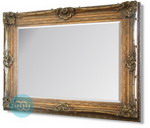 Very Large Gold Rococo styled framed mirror with intricate detailing and scrolling.This photograph cannot capture the grandeur of this very large mirror.Combines massive proportions with an elegance rarely available in modern home furnishings.