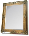 Very Large Gold Rococo styled framed mirror with intricate detailing and scrolling.  This photograph cannot capture the grandeur of this very large mirror.Combines massive proportions with an elegance rarely available in modern home furnishings.