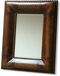 Traditional Deep padded Brown faux leather that softens and enriches the bevelled mirror, complete with studs.