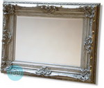 Very Large Gold Rococo styled framed mirror with intricate detailing.  This photograph cannot capture the grandeur of this very large mirror.  Combines massive proportions with an elegance rarely available in modern home furnishings. 