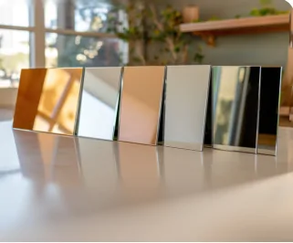 Six upright mirror glass sample panels in different finishes