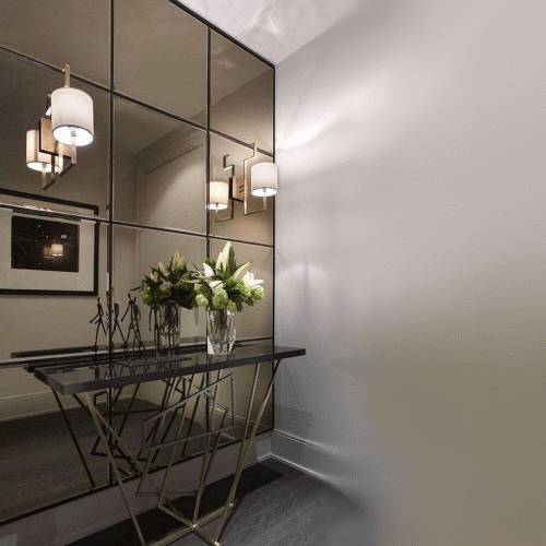 Bronze tinted mirror tile wall design bronze tinted mirror tiles arranged as a decorative feature wall