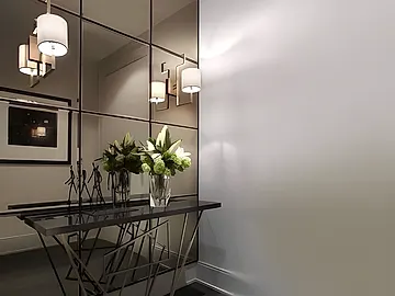 bronze tinted mirror tiles used as a feature wall