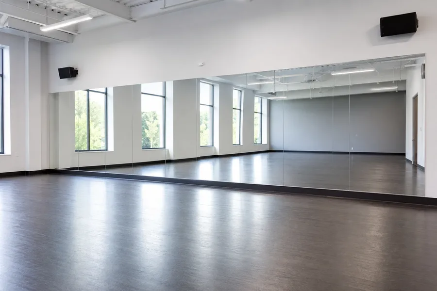 Wide dance studio mirror wall for rehearsal and teaching