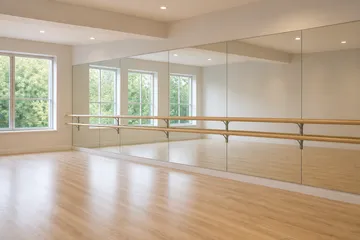 Ballet barre and mirrors in a neat dance studio