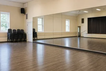 Community studio mirrors in a multi-use room