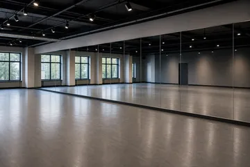 Large rehearsal studio mirrors fitted across a long wall